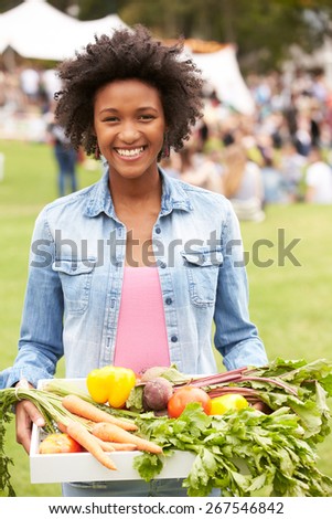 Woman With Fresh Produce Bought At Outdoor Farmers Market