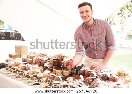 Stall Holder At Farmers Food Market Selling Nuts And Seeds