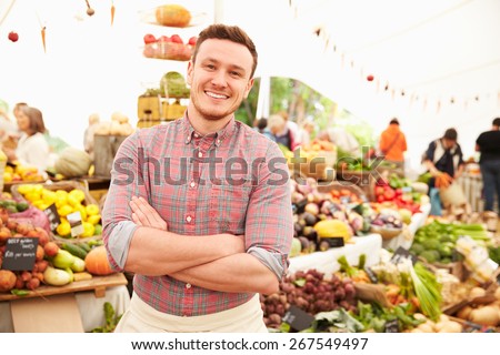 Male Stall Holder At Farmers Fresh Food Market