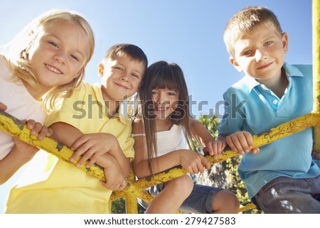 Group Of Children Playing On Climbing Frame