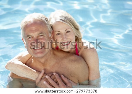 Similar – Image, Stock Photo Mature couple swimming together in fresh water