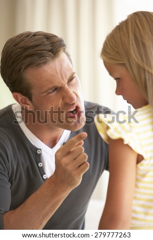 Father Telling Off Daughter At Home