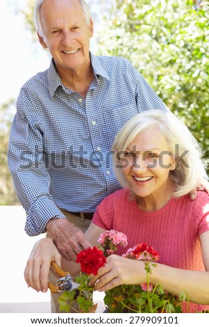 Mid age woman and father in garden