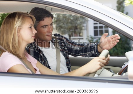 Father Teaching Teenage Daughter To Drive