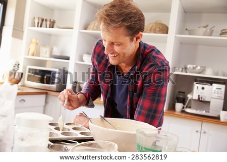 Middle aged man preparing to bake