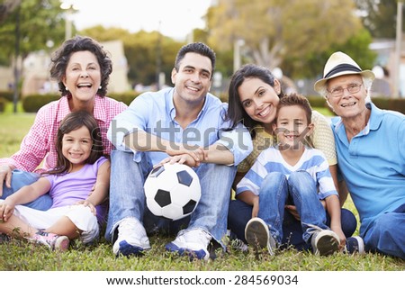 Multi Generation Family Playing Soccer Together