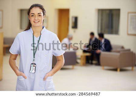 Portrait Of Female Nurse In Hospital Reception