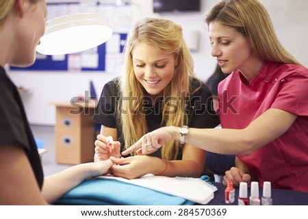 Teacher Helping Students Training To Become Beauticians