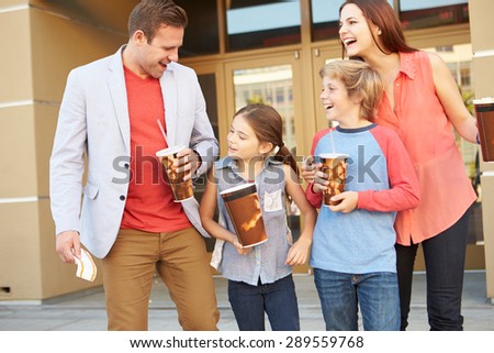 Family Standing Outside Cinema Together