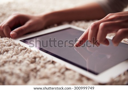 Close up of person?s hand using a tablet computer