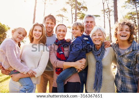 Happy multi-generation family portrait in the countryside