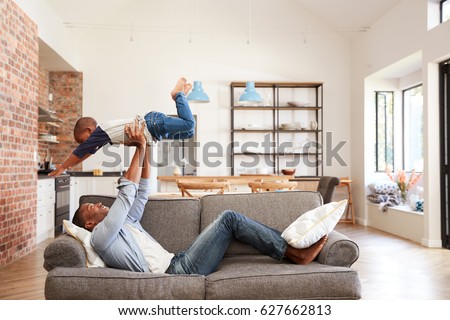 Similar – Image, Stock Photo Carefree black man lying on blanket with laptop in park