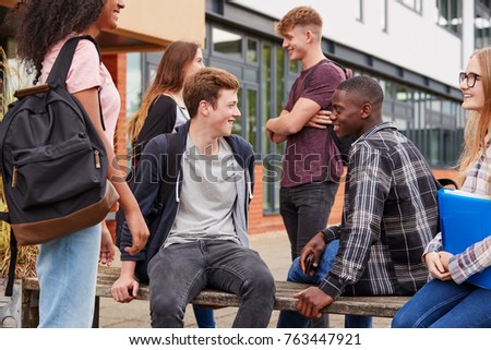 Similar – Foto Bild Glücklich ethnischen männlichen Teenager auf Skateboard liegen und lächelnd