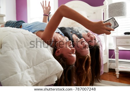 Similar – Image, Stock Photo Teenage girl lying in a blue armchair