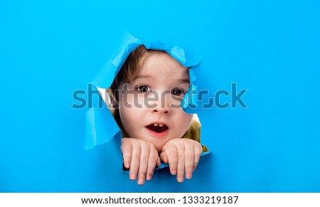 Similar – Image, Stock Photo Child looks through hole in snow