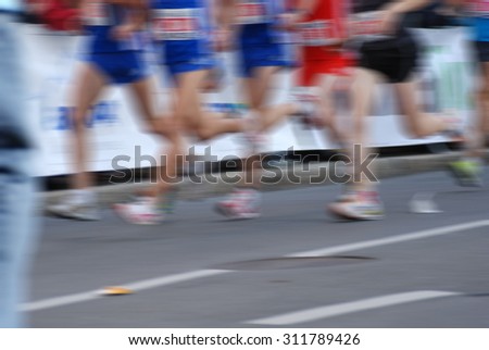 group of runners, blurred motion