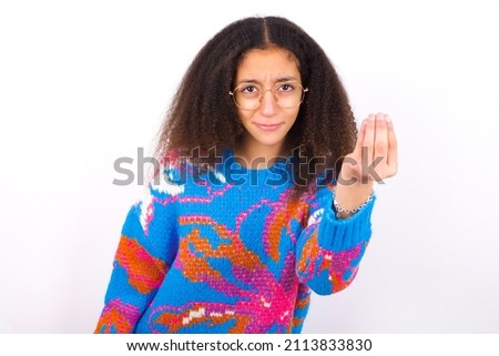 Similar – Image, Stock Photo A girl in a red Christmas hat is making gingerbread dough in the kitchen. Christmas tradition, Christmas atmosphere, preparation for the holiday