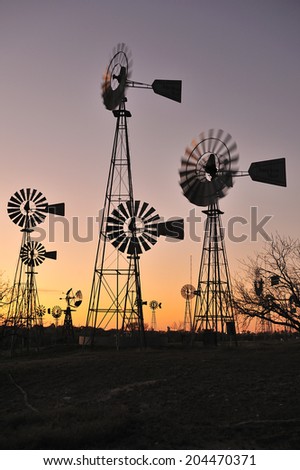 Lubbock, Texas, USA, - April. 1. 2012: Silhouette of windmills at American Wind Power Center, the museum displaying various windmills, Lubbock, Texas