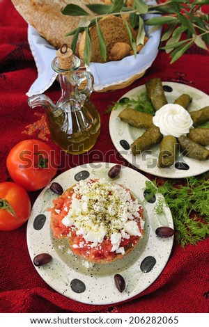 Greek salad with goat cheese, crushed tomato and olives, traditional Greek food