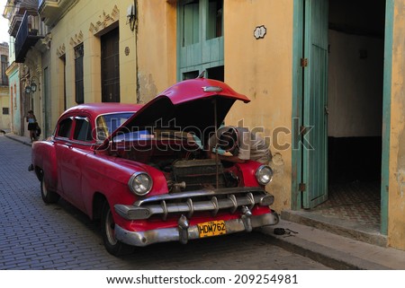 HAVANA, CUBA, - November. 1. 2010: people fixing old classic car on the street in Havana, Cuba