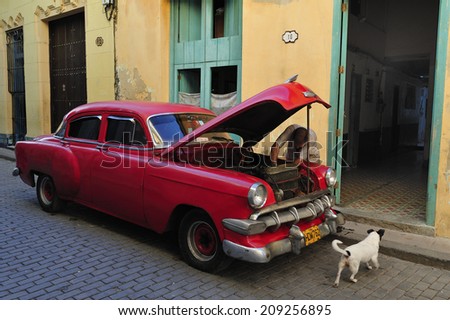 HAVANA, CUBA, - November. 1. 2010: people fixing old classic car on the street in Havana, Cuba
