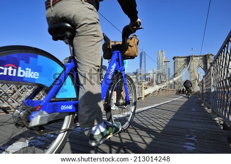 New York City, USA, - May. 19. 2014: Bike riders commuting to Manhattan by Citi Bike over Brooklyn Bridge. New York, USA