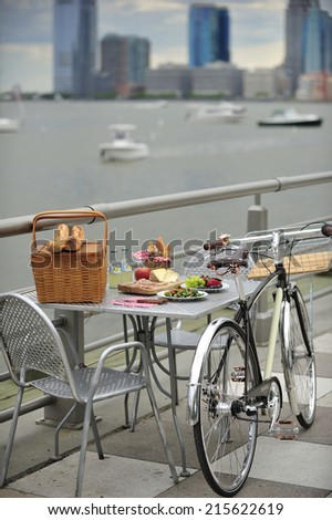 New York City, USA, - May. 18. 2014: Bicycle and picnic lunch by Hudson River, Tribeca, New York, USA