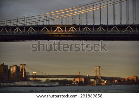 Sunset over Williamsburg Bridge and Queensboro Bridge in New York City, New York