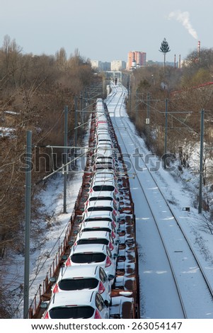 BUCHAREST, ROMANIA - February 9: A train full of new Ford Fiesta cars are exported by train in Bucharest, on February 9, 2015. The Ford Fiesta is a supermini car manufactured by the Ford Motor Company