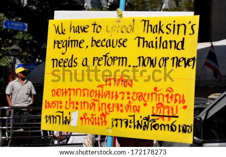 Bangkok, Thailand January 13, 2014:  Political sign protesting Thaksin government carried by a protestor at one of the Operation Shut Down Bangkok demonstrations