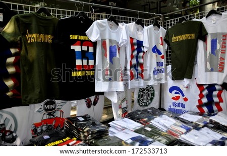 Bangkok, Thailand January 16, 2014: Vendors cash in on the Shut Down Bsngkok protest by selling souvenir tee-shirts of the event at portable stands on Silom Road