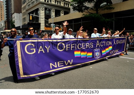 New York, NY - 30 June 2013:  Members of the Gay Officers Action League marching behind their banner at the annual Gay Pride Parade on Fifth Avenue