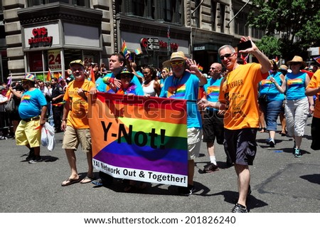 NYC - June 29, 2014:  Marchers from the Y-NOT group with their rainbow banner at the 2014 Gay Pride Parade on Fifth Avenue