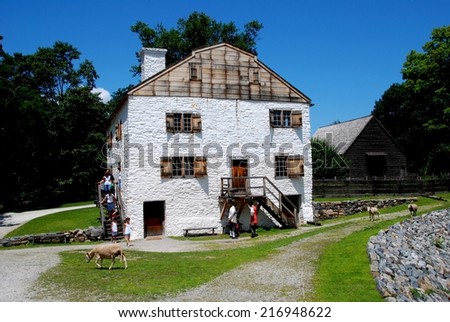 SLEEPY HOLLOW, NY - July 10, 2009: Sheep walk on the pathways in front of the manor house built by Frederick Philipse at c. 1750 Philipsburg Manor