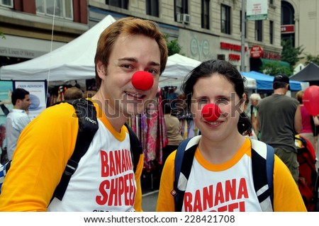 NYC - June 12, 2010:  Performers sporting red clown noses promote the Cirque du Soleil\'s BANANA SHPEEL show at an Upper West Side street festival