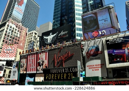 NYC - May 5, 2010:   Advertising signs cover the west front of the Bettelsmann Building in Times Square