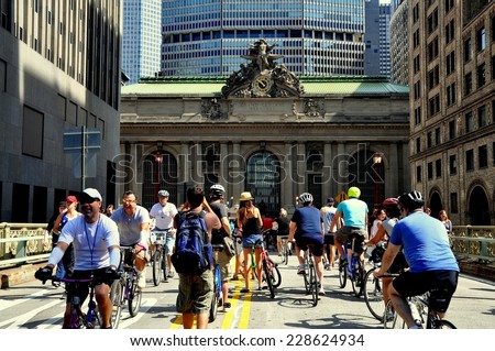 NYC - August 16, 2013:  Bikers, joggers, and pedestrians enjoy a traffic free Park Avenue in front of Grand Central Terminal at the third annual \