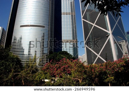 Hong Kong, China - December 20, 2007:  Left to right - ICBC Bank, Cheung Leung Building, and the Bank of China with purple Bauhinia flowers in Hong Kong Park