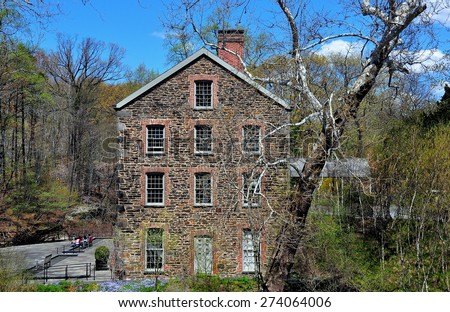 Bronx, New York - April 29, 2015:  The 1840 Old Stone Mill on the Bronx River at the New York Botanical Garden  *