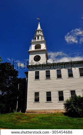Fitzwilliam, New Hampshire - July 11, 2013:  The 1775 Original Meeting House church with its elegant, tiered steeple and clock tower