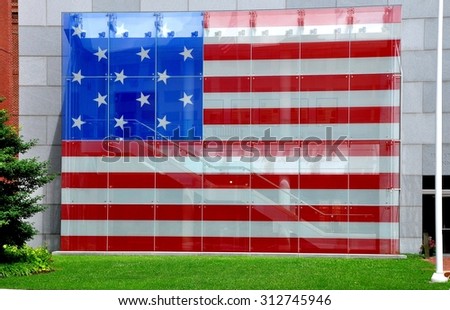 Baltimore, Maryland - July 23, 2013:  A replica of the circa 1812 American flag is displayed in the courtyard garden at the 1793 Star Spangled Banner House