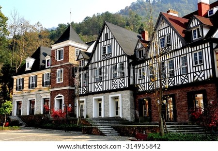 Bai Lu, China - November 17, 2013:  French style half-timbered manor houses line a square in the Sino-French village