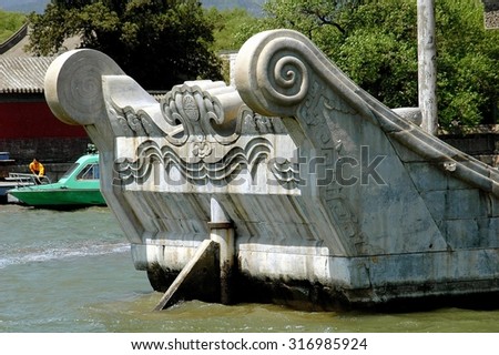 Beijing, China - May 4, 2005:  Bow of the ornate carved marble boat moored on Kunming Lake at the Summer Palace