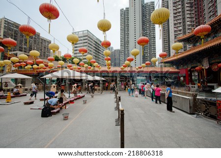 HONG KONG - JUN 13 : People at Wong Tai Sin Temple on Jun 20, 2013. It is a Taoist temple established in 1921. Wong Tai Sin Temple is one of the most famous and major tourist attraction in Hong Kong.