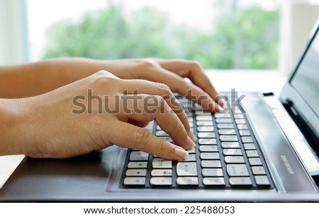 Hands Typing on Notebook PC