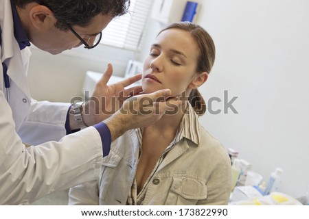 Woman Palpating Lymph Node