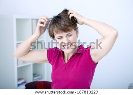 Woman itching her head