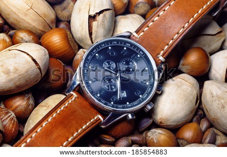Close-up of men\'s watch with brown leather strap