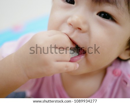 Similar – Image, Stock Photo 13 month old baby trying to navigate a ladder at a playground; reaching and pulling up to tip toes