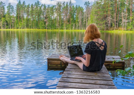 Similar – Wooden planked footway in calm evening lake